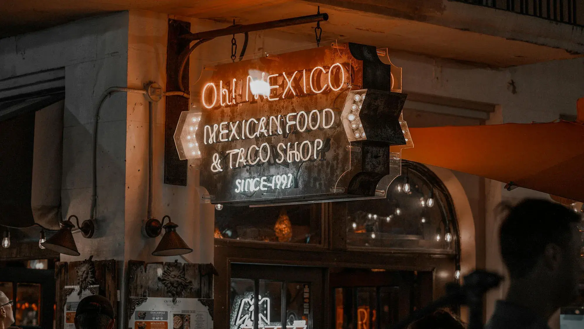 Local business sign at night